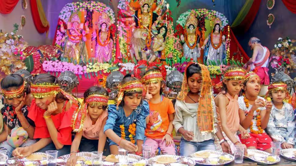 Little girls receiving prasad and gifts as part of Kanjak Puja organized under community welfare program
