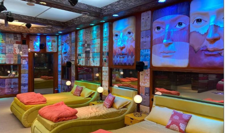 Bigg Boss house bedroom with colorful interiors and neatly arranged beds.