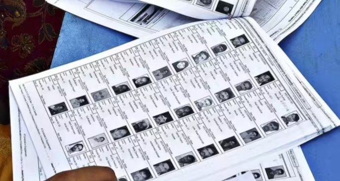 Election officials verifying voter list during nationwide revision in India