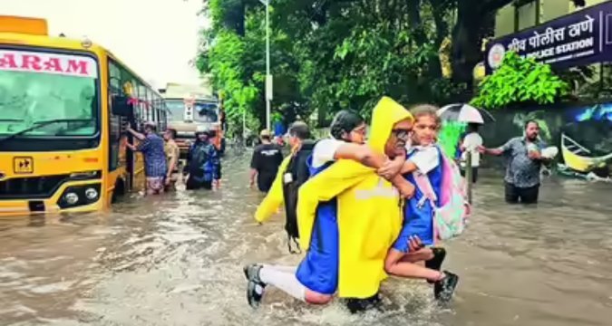 NDRF teams evacuating residents near Mithi River in Kurla during heavy rains