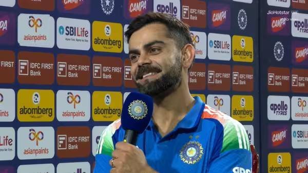 Virat Kohli celebrating a historic milestone in international cricket