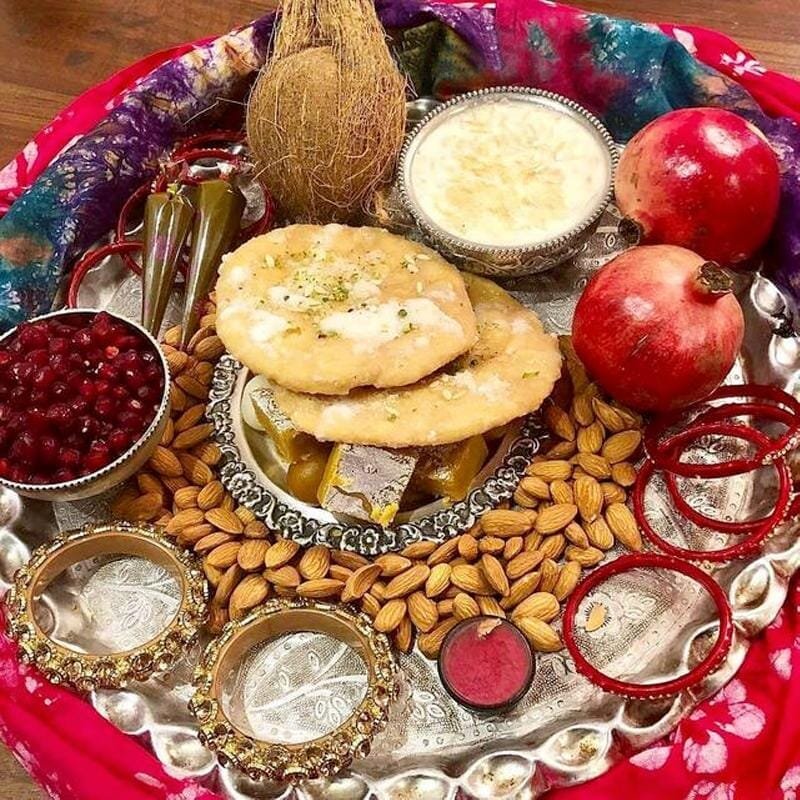 Karwa Chauth sargi platter with pheni, dates, nuts, rose petals