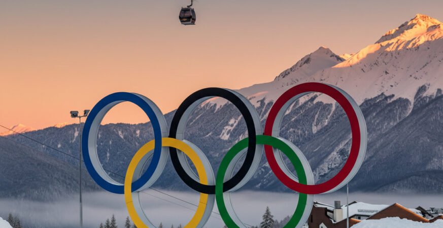 Winter Olympics stadium decorated with Olympic rings during competition