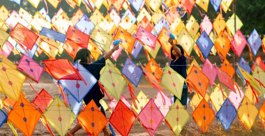 People flying kites during Makar Sankranti celebrations in India